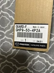 Genuine Mazda Stone Guard GHP9-50-4P2A. Fixed Price $8.00.
